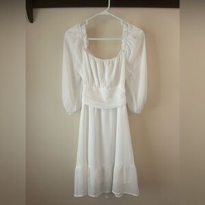 Never been worn white chiffon long sleeve dress with tie back. Tags still on it.
